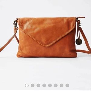 Wanderers tan envelope crossbody